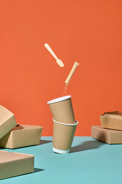 Minimalist Composition With Coffee Cups and Biodegradable Packaging