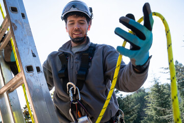 Worker Adjusting Safety Rope