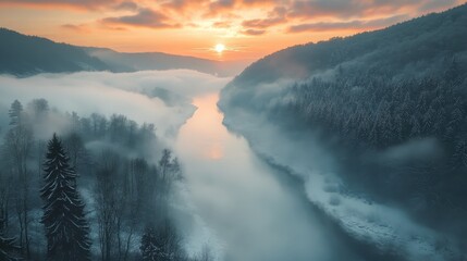 Fototapeta premium Serene Foggy Valley at Sunrise over the River with Soft Light and Lush Green Trees Surrounded by Mist and Calm Water Reflections