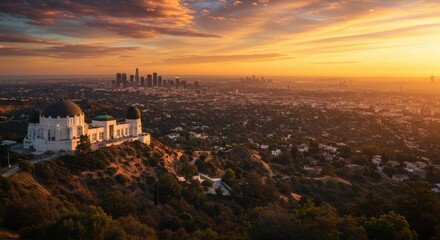Fototapeta premium Breathtaking Sunset View Over Los Angeles from Griffith Observatory with Dramatic Clouds and City Skyline in the Distance