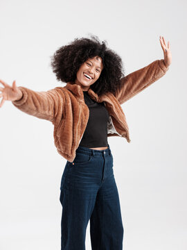 Smiling Woman Expressing Joyful Energy in Stylish Modern Clothing