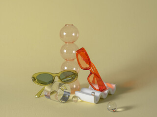 Colorful sunglasses and geometric glass objects arranged
