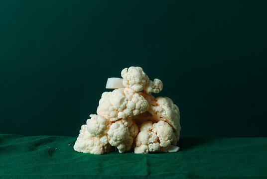 stalks of raw cauliflower forming a stack