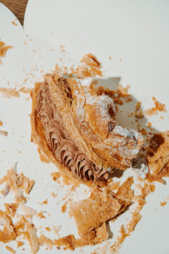 piece of puff pastry cake on a paper box