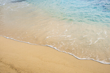 Beach sand background for summer vacation concept. Beach nature and summer seawater with sunlight light sandy beach Sparkling sea water 