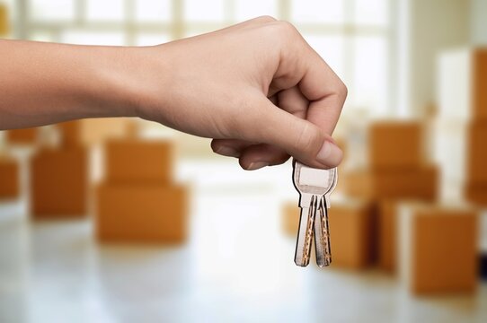 happy young person receiving keys at new home