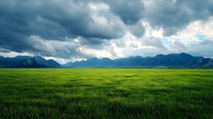 Obraz premium Green Field Dramatic Mountain Landscape