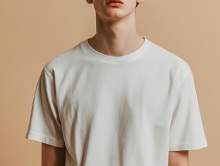 Minimalist Image of a Person Wearing a White T Shirt Against a Neutral Background Presentation