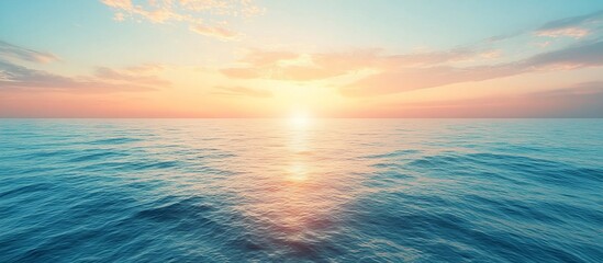 Obraz premium Serene sunset over calm ocean waters with vibrant colors reflecting on the surface, evoking tranquility