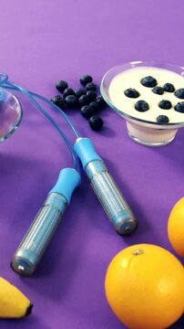 Dumbbells, banana, water glass, fruit, skipping rope and breakfast