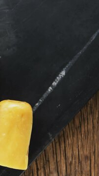 Sliced cheese with crispy biscuits, seeds, rosemary herb and sauce