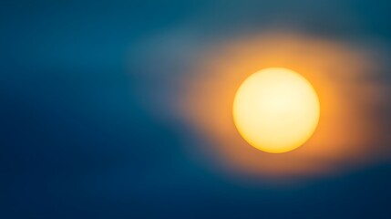 Large Yellow Sun Setting Behind a Dark Blue Sky