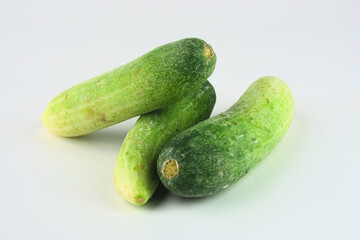 Fresh Green Cucumbers Arranged on a Clean White Background for Culinary Use