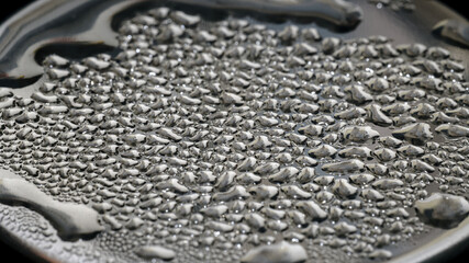 Water vapor condenses on metal surfaces