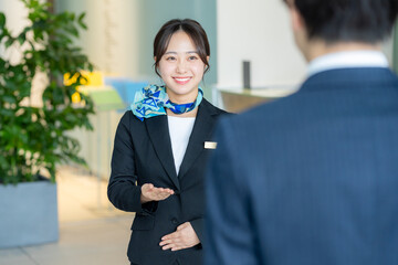 受付の若い女性【撮影協力:スカパー東京メディアセンター】	