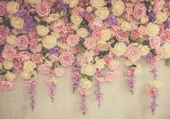 Abundant floral composition featuring roses in various shades of pink, yellow, blue, and navy, creating a vibrant and eye-catching pattern