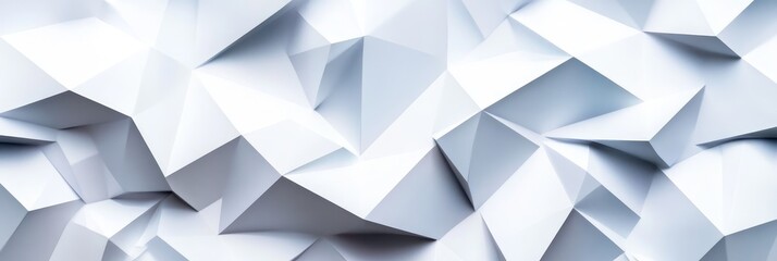 Abstract White Geometric Shapes - Close-up of an abstract background featuring a collection of light gray and white geometric shapes creating a three-dimensional, textured effect.