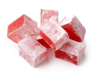 Red Turkish delight cubes dusted with powdered sugar arranged on a white surface