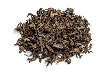 A pile of large-leaf black tea on a white background. Dried tea leaves.