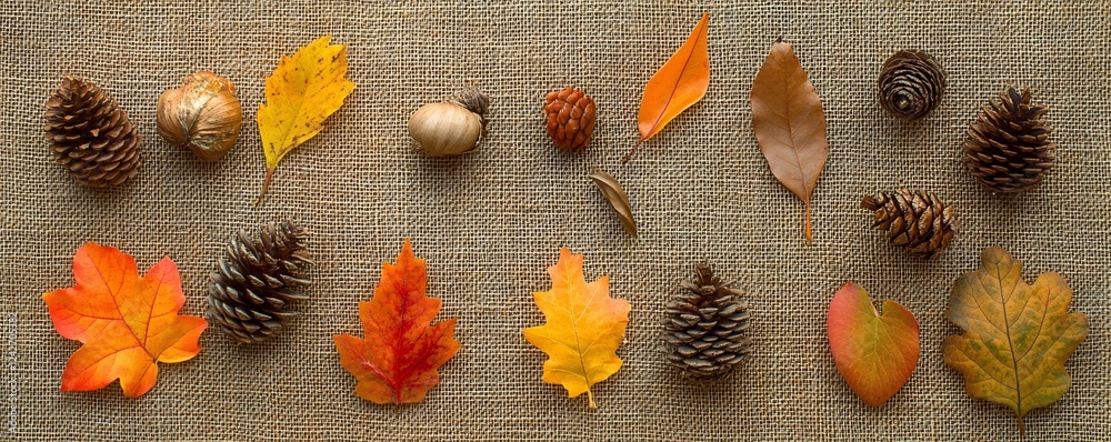 Aufkleber Stunning fall still life display set against a rustic burlap backdrop