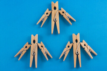 Three clothespin figures, each with unique arm positions, stand side-by-side. The image evokes a sense of individuality and the power of creative expression.