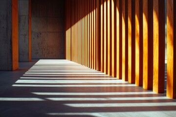 Fototapeta premium A close-up of vertical wooden slats in an outdoor building wall, illuminated by the morning sun casting long shadows on the concrete floor. 