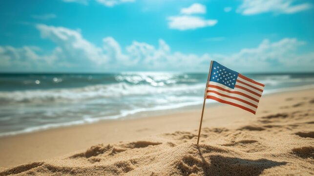 American flag planted in the sand on a sunny beach. - Powered by Adobe