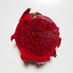 Red dragon fruit in a white background