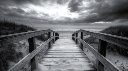 Tranquil wooden bridge path to peaceful beach at dramatic sunset