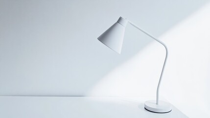A contemporary LED table lamp with a flexible neck and a minimalist white finish