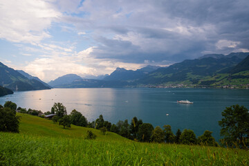 Mountain in the in summer, panoramic view with mountain. Alps mountains. Alpine mountain scenery. Mountain with lake in Alps. Mountains over the lake and the alps.