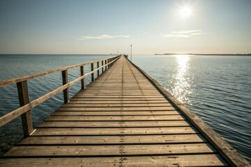 Fototapeta premium Wooden pier stretching into the distance with sunlight reflecting off its surface, outdoor, water, calm, wood, reflection