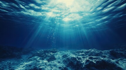 Fototapeta premium Ocean Depth: Sunlight Beams Illuminate Underwater World