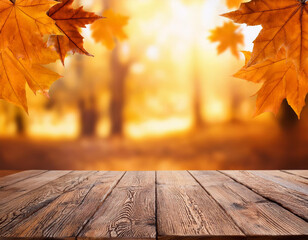 Wooden table with orange leaves autumn background