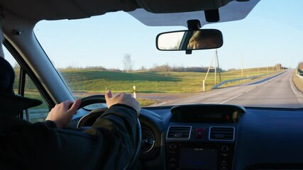 Reckless drinking while driving, showing dangerous behavior and interior car view swerving back and forth on empty road