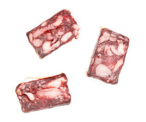 Three pieces of meat are cut into small squares