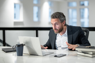 Fototapeta premium Business offices place. Businessman working with laptop in office. Business man director using laptop. Millennial manager at office workplace. Office workers business people at office.