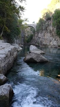 Oluk or Eurymedon Bridge. Bridge Canyon ( Turkish; K&ouml;pr&uuml;l&uuml; Kanyon ) national park. Historical Roman bridge over the Koprucay river. One of the touristic landmarks of Antalya. Travel to Turkey country