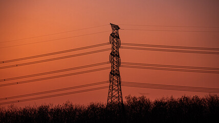 High voltage transmission lines in the sunset