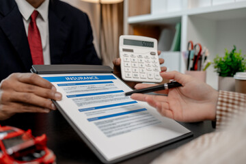 a lawyer is explaining the details of a car insurance policy to the car owner before she signs it, a lawyer explains to his client what will happen if she doesn't get car insurance