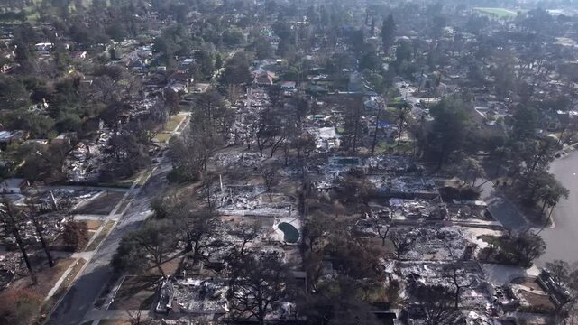 Homes In a Altadena Neighborhood Destroyed By Eaton Wildfire In Los Angeles, California. Aerial Shot.