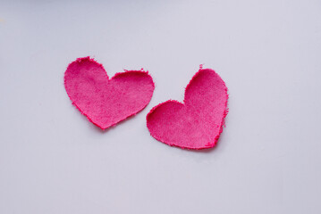 hearts pink textile hand cutting on white textile background