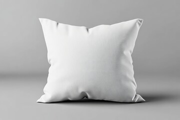 A single white square pillow on a gray background