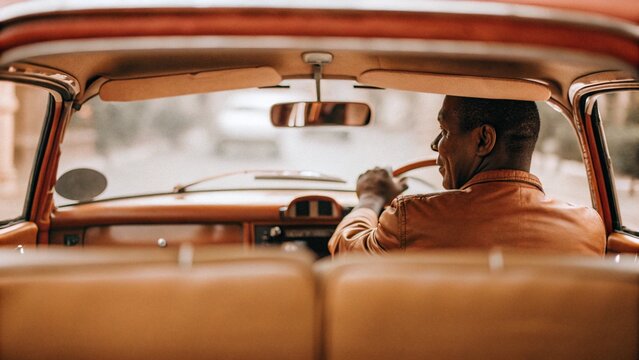 A man driving classic car