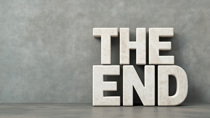 The end title with concrete letters standing on gray floor against gray concrete wall