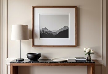 Framed Landscape Photo Above Console Table: Neutral Tones, Wood & Marble Accents, Scandinavian Decor, Bowl of Books, Moody Lighting, Beige Background, Elegant Interior