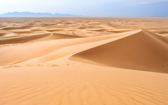Open desert with distant sand dunes at wind