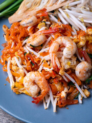 Pad Thai is a stir fry rice noodles with shrimp. Popular Thai street food.
