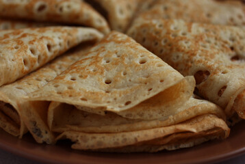 baked pancakes openwork in a hole triangles close-up