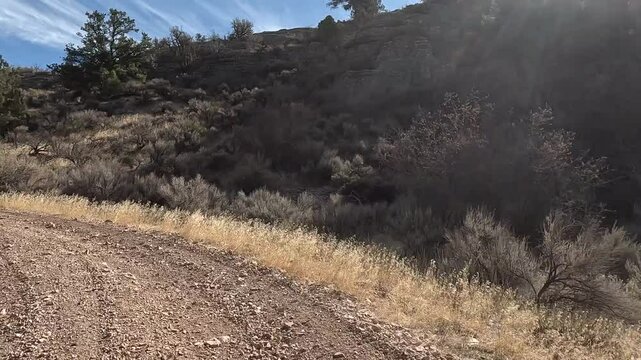Recreation road mountain dirt desert Utah POV fast. Off road trail riding in 4x4 all terrain vehicle for sport and recreation. Desert landscape, dusty trails and recreation areas. Southwest Utah